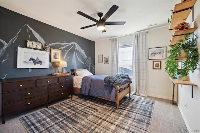 carpeted bedroom with baseboards, ceiling fan, and visible vents