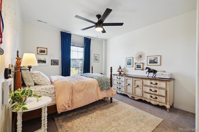 carpeted bedroom with visible vents and a ceiling fan