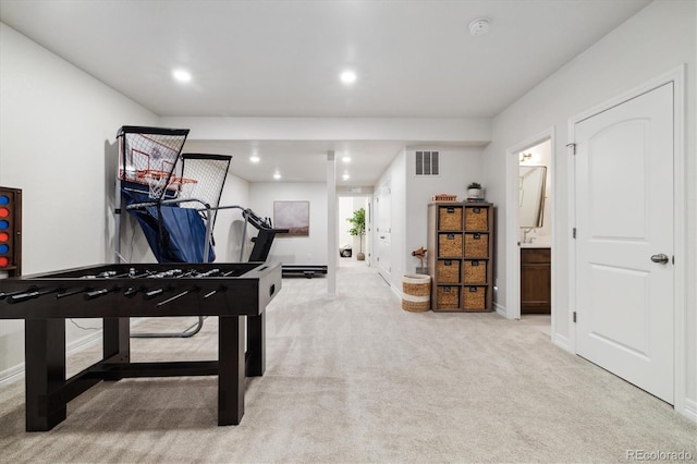 rec room with light colored carpet, visible vents, and recessed lighting