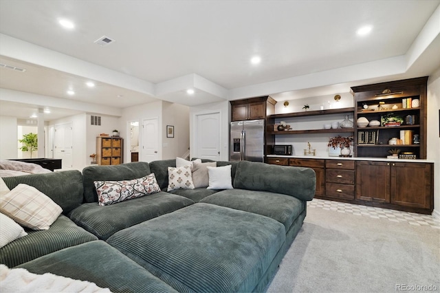 living room with light colored carpet, recessed lighting, and visible vents
