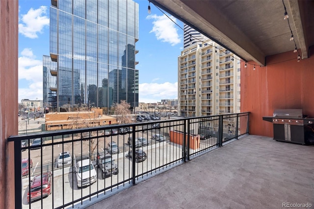 balcony featuring a view of city and a grill