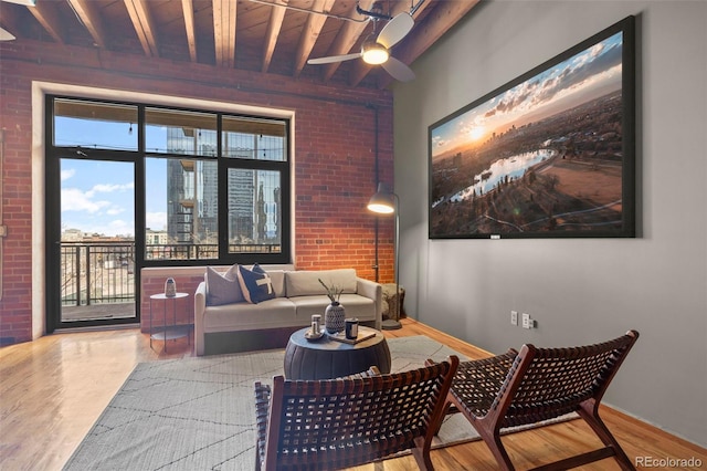 1800 Lawrence St Unit 303, Denver, CO 80202 - living room featuring beamed ceiling, plenty of natural light, wooden ceiling, and wood finished floors
