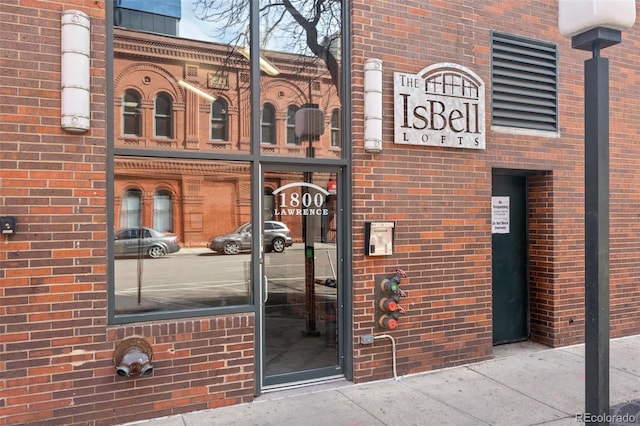 1800 Lawrence St Unit 303, Denver, CO 80202 - view of exterior entry featuring brick siding