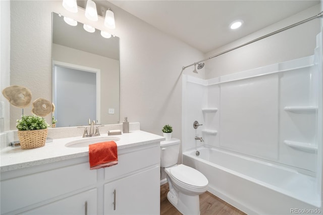 full bathroom featuring vanity, wood-type flooring, shower / tub combination, and toilet