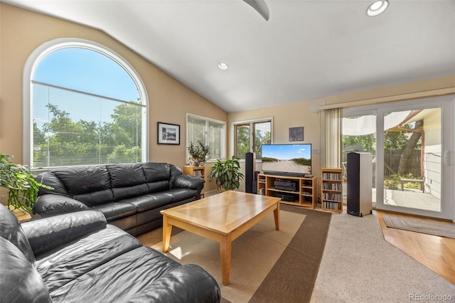 3176 S Alton Ct, Denver, CO 80231 - carpeted living area with vaulted ceiling and recessed lighting