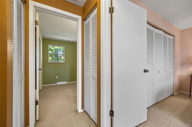 3176 S Alton Ct, Denver, CO 80231 - hallway featuring light colored carpet