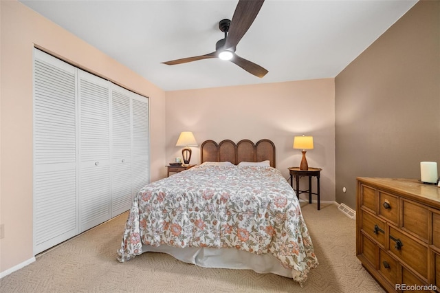 3176 S Alton Ct, Denver, CO 80231 - bedroom with light carpet, a closet, and a ceiling fan