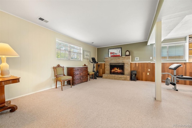 3176 S Alton Ct, Denver, CO 80231 - living room with carpet floors, a fireplace, and wood walls