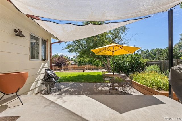3176 S Alton Ct, Denver, CO 80231 - fenced backyard featuring a patio and outdoor dining area