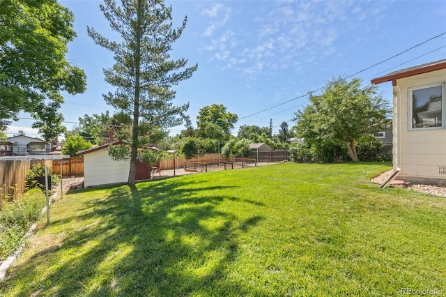 3176 S Alton Ct, Denver, CO 80231 - fenced backyard with a storage unit