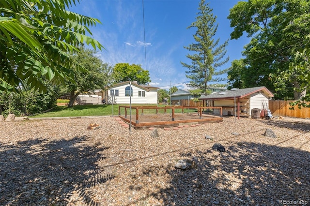 3176 S Alton Ct, Denver, CO 80231 - view of yard with a vegetable garden and an outdoor structure