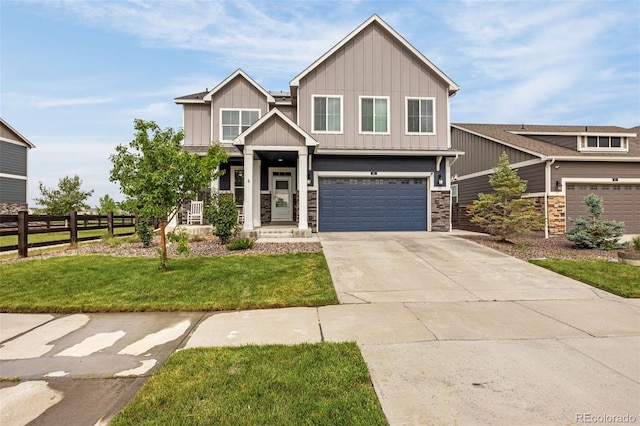 91 S Quantock St, Aurora, CO 80018 - craftsman-style house with board and batten siding, stone siding, driveway, and an attached garage