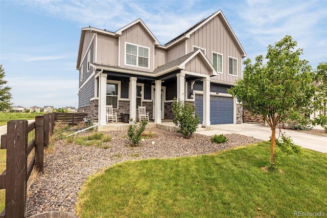 91 S Quantock St, Aurora, CO 80018 - craftsman-style home featuring a porch, board and batten siding, stone siding, and concrete driveway