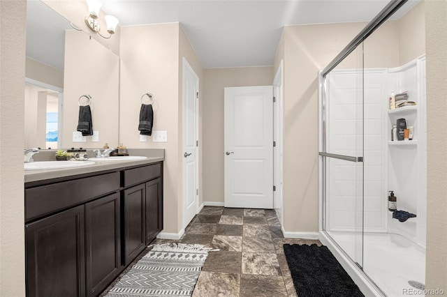 91 S Quantock St, Aurora, CO 80018 - full bathroom with double vanity, a stall shower, and stone finish flooring