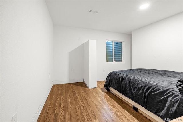 91 S Quantock St, Aurora, CO 80018 - bedroom with wood finished floors and baseboards