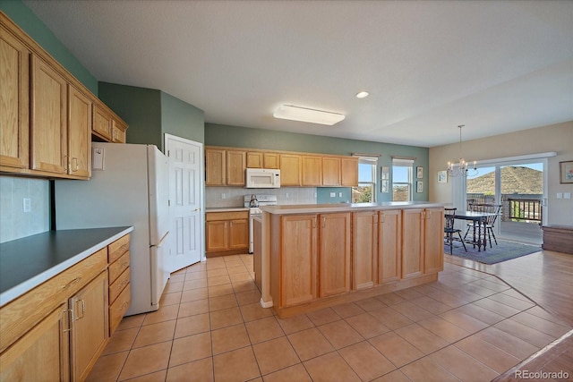 kitchen featuring light countertops, decorative backsplash, light tile patterned flooring, a notable chandelier, and white appliances