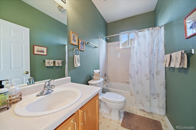 full bathroom with shower / bath combo with shower curtain, toilet, vanity, and a textured wall