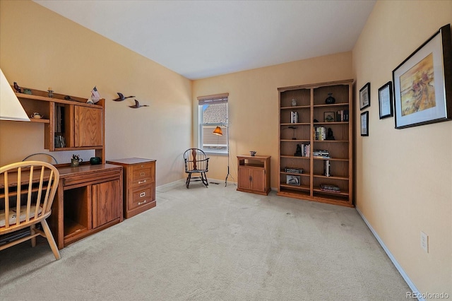 office space with light carpet and baseboards