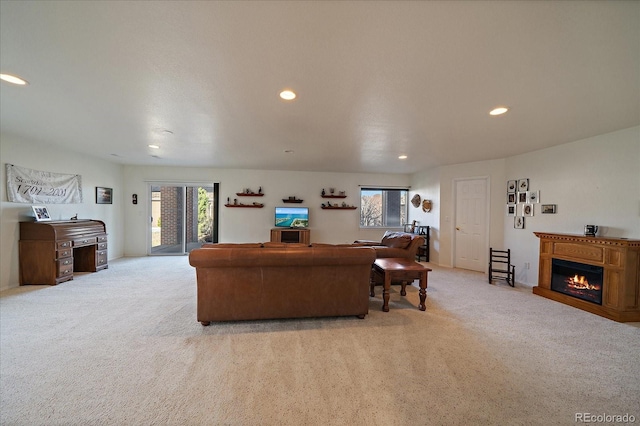 living room with a wealth of natural light, light carpet, and recessed lighting