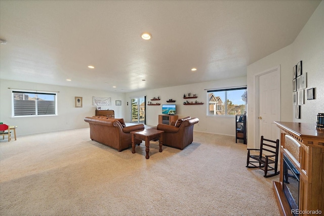 living room with light carpet and recessed lighting