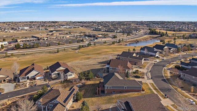 birds eye view of property featuring a residential view and a water view