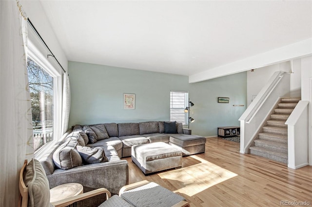 living room featuring a wealth of natural light and light wood-type flooring