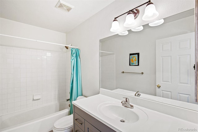 full bathroom featuring shower / bath combo, vanity, and toilet