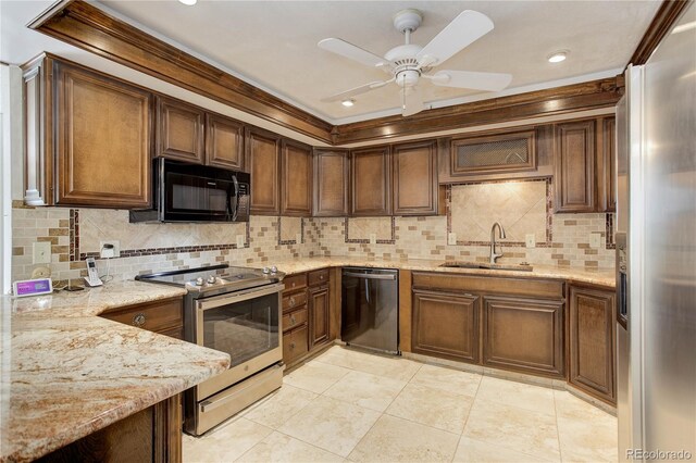 3561 Kalispell St, Aurora, CO 80011 - kitchen featuring stainless steel appliances, light stone countertops, decorative backsplash, ceiling fan, and recessed lighting