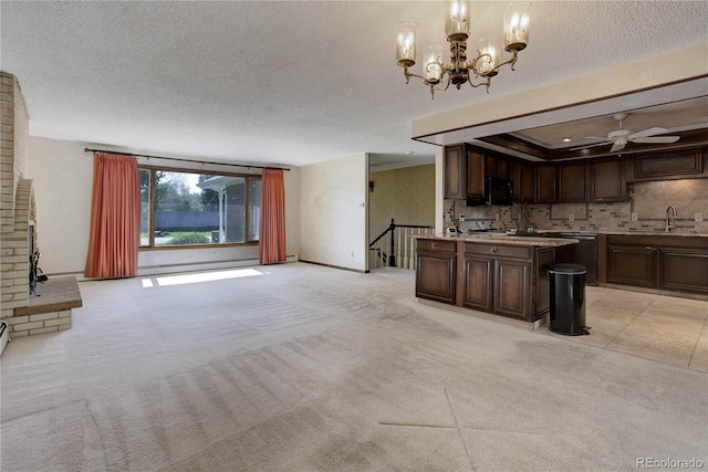 3561 Kalispell St, Aurora, CO 80011 - unfurnished living room with a textured ceiling, light carpet, ceiling fan, and a chandelier