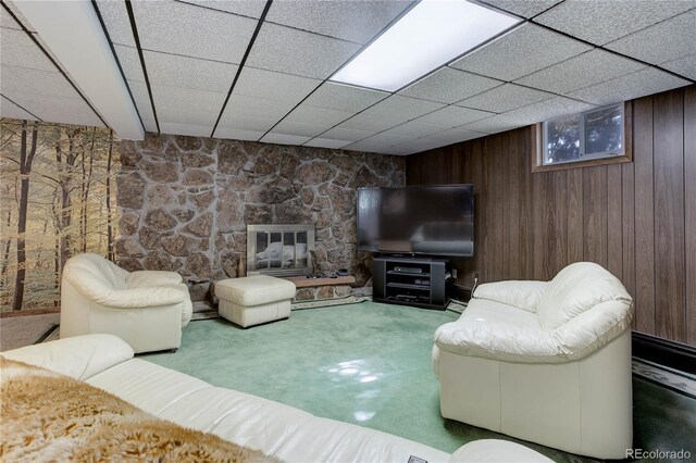 3561 Kalispell St, Aurora, CO 80011 - carpeted living room with wood walls