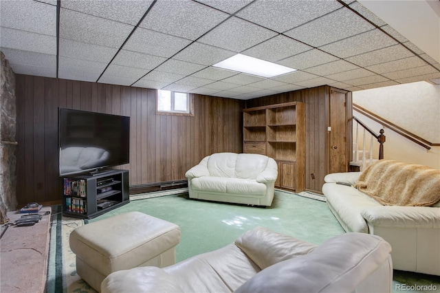 3561 Kalispell St, Aurora, CO 80011 - living room featuring wood walls, carpet floors, and baseboard heating