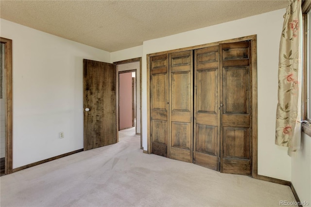 3561 Kalispell St, Aurora, CO 80011 - unfurnished bedroom with carpet floors, a textured ceiling, and a closet