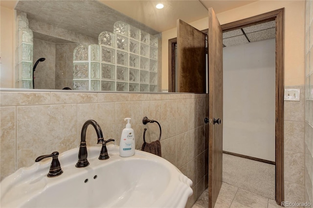 3561 Kalispell St, Aurora, CO 80011 - bathroom with walk in shower, tile patterned flooring, and tile walls
