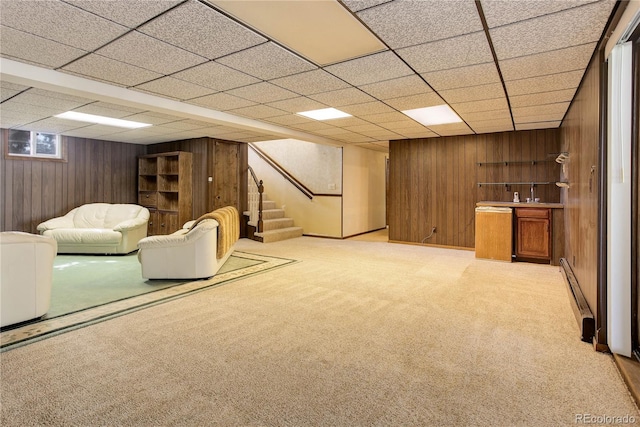3561 Kalispell St, Aurora, CO 80011 - finished basement with wooden walls, bar with sink, stairs, carpet, and a drop ceiling
