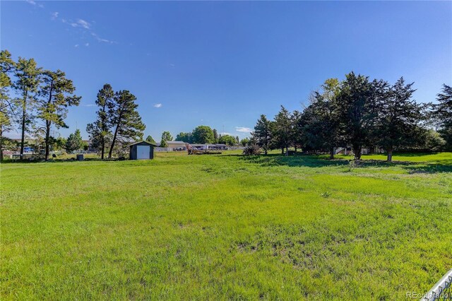 3561 Kalispell St, Aurora, CO 80011 - view of yard featuring a storage unit