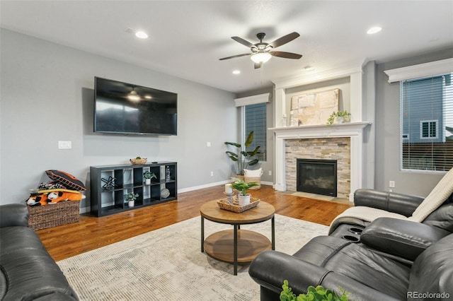 9632 Emerald Vista Dr, Peyton, CO 80831 - living room with wood finished floors, ceiling fan, a fireplace, and recessed lighting