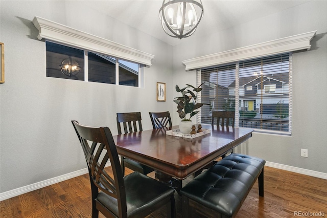 9632 Emerald Vista Dr, Peyton, CO 80831 - dining area with a chandelier, dark wood finished floors, and healthy amount of natural light