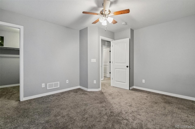 9632 Emerald Vista Dr, Peyton, CO 80831 - unfurnished bedroom featuring carpet, a spacious closet, ceiling fan, and a closet