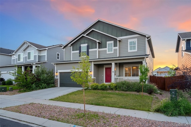 9632 Emerald Vista Dr, Peyton, CO 80831 - view of front facade featuring board and batten siding, a porch, driveway, and a garage