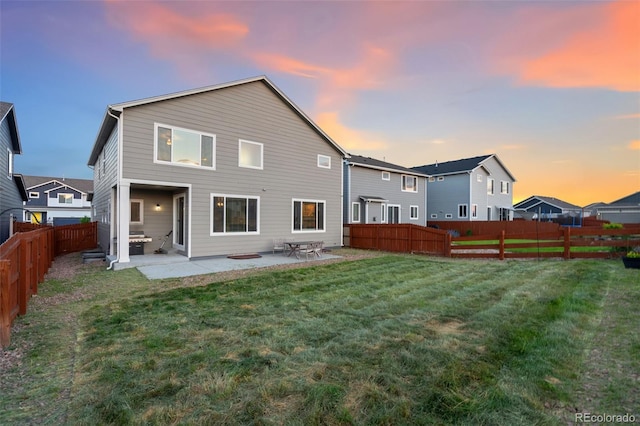 9632 Emerald Vista Dr, Peyton, CO 80831 - back of property with a fenced backyard and a patio