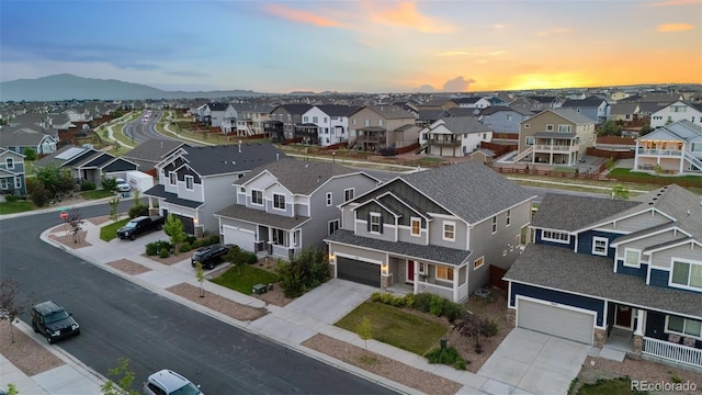 9632 Emerald Vista Dr, Peyton, CO 80831 - aerial view at dusk of a residential view and a mountain view