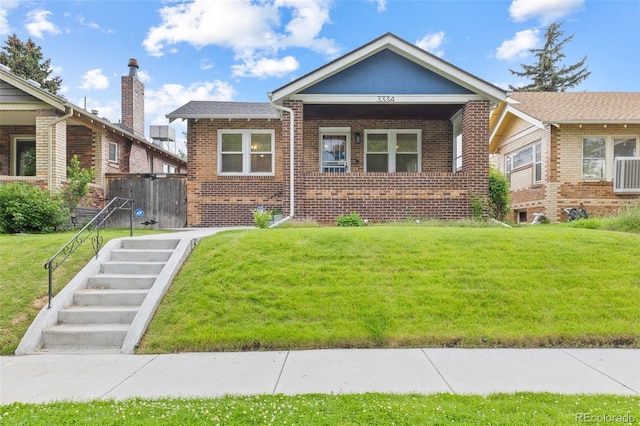 3334 W 37th Ave, Denver, CO 80211 - bungalow with brick siding and a front lawn