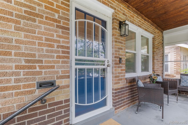3334 W 37th Ave, Denver, CO 80211 - view of exterior entry featuring brick siding and covered porch