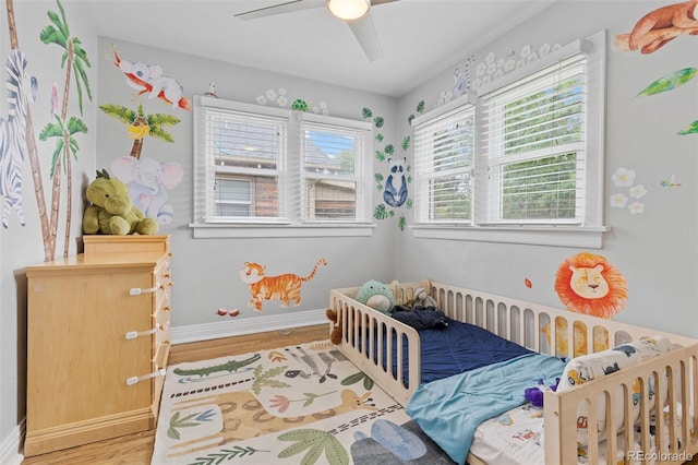3334 W 37th Ave, Denver, CO 80211 - bedroom with light wood finished floors, baseboards, and a ceiling fan