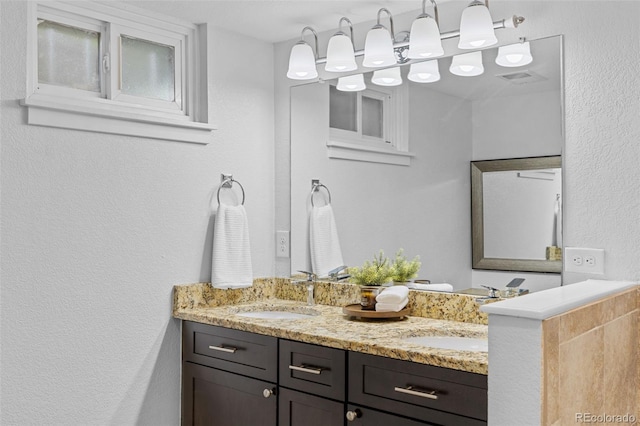 3334 W 37th Ave, Denver, CO 80211 - bathroom featuring double vanity and a textured wall