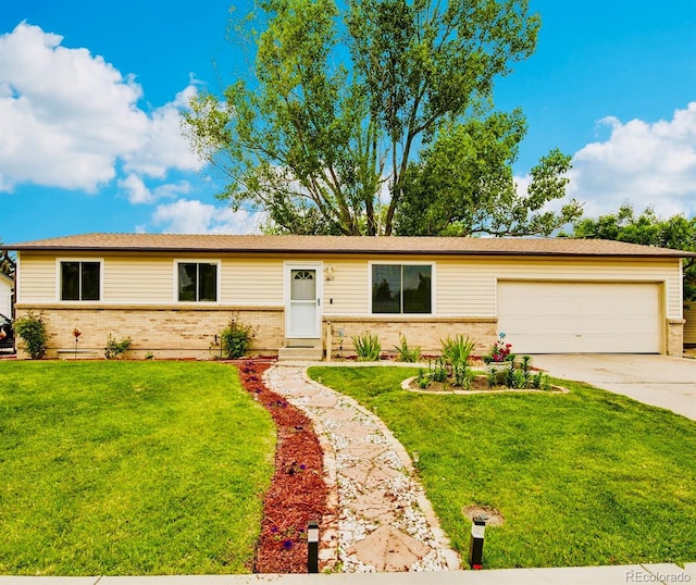7075 Welch Ct, Arvada, CO 80004 - single story home with brick siding, driveway, an attached garage, and a front yard