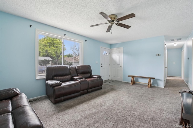 7075 Welch Ct, Arvada, CO 80004 - carpeted living area featuring ceiling fan, a textured ceiling, and baseboards