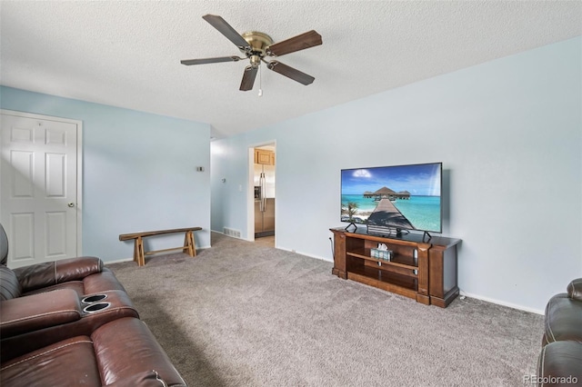 7075 Welch Ct, Arvada, CO 80004 - living area featuring ceiling fan, carpet, a textured ceiling, and baseboards