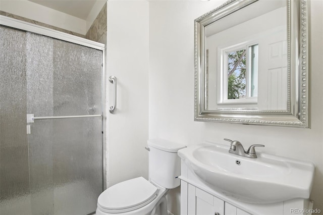 7075 Welch Ct, Arvada, CO 80004 - bathroom with toilet, vanity, and a shower stall