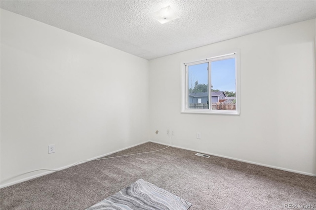 7075 Welch Ct, Arvada, CO 80004 - spare room featuring carpet floors, a textured ceiling, and baseboards